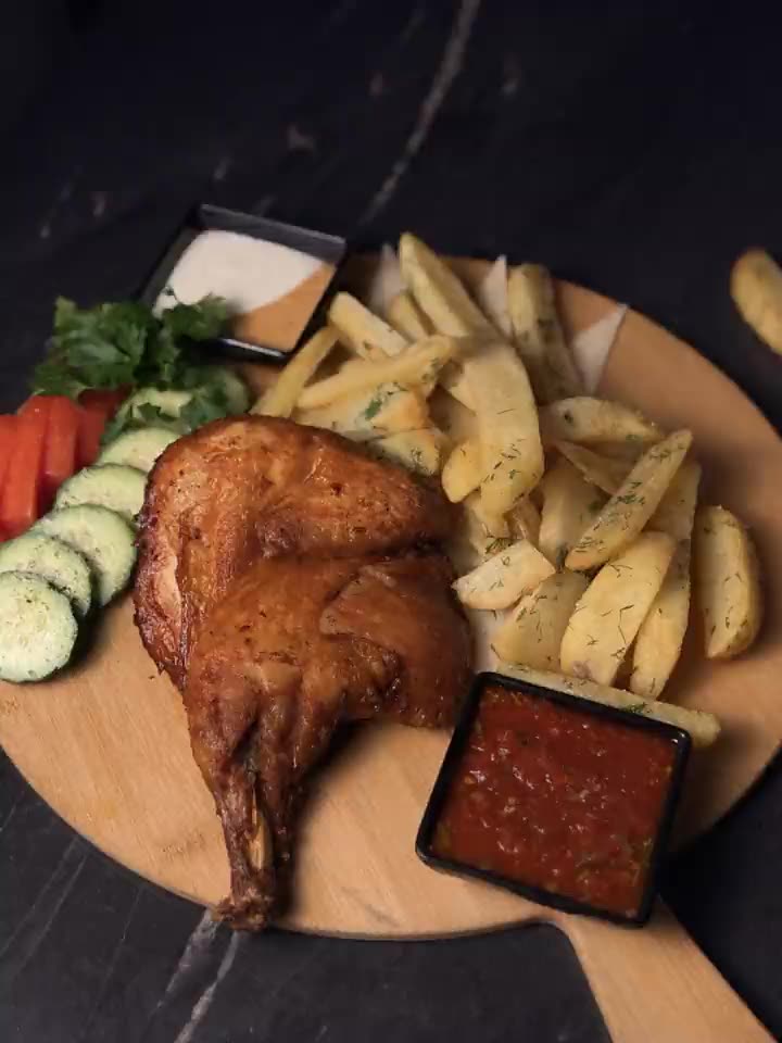 Roasted half chicken with potato wedges